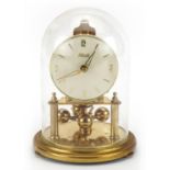 Kendo brass anniversary clock under a glass dome, 18cm high For further information on this lot