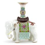 Chinese porcelain candlestick in the form of an elephant, hand painted in the famille rose palette