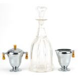 Continental glass decanter and American chrome plated lidded sugar bowl and milk jug, the largest