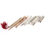 Ten Victorian and later silver, white metal and yellow metal propelling pencils including one with