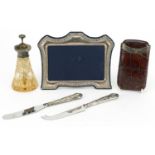 Silver items including a Victorian silver mounted leather cigar case, easel photo frame and atomiser