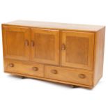 Ercol Windsor 468 light elm sideboard fitted with three doors above two drawers, 76cm H x 129.5cm