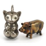 Novelty brass vesta case in the form of a pig and a silver plated baby's rattle in the form of a