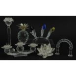 Six Swarovski Crystal sculptures including three branch candleholder, set of three coloured flowers,