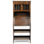 Arts & Crafts carved oak bureau bookcase with pair of glazed doors above a fall and open shelves,