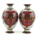 Pair of Japanese cloisonne vases enamelled with mythical birds and flowers, each 16cm high For