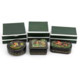 Three Russian lacquered boxes with boxes, each hand painted with figures, the largest 8.5cm wide For