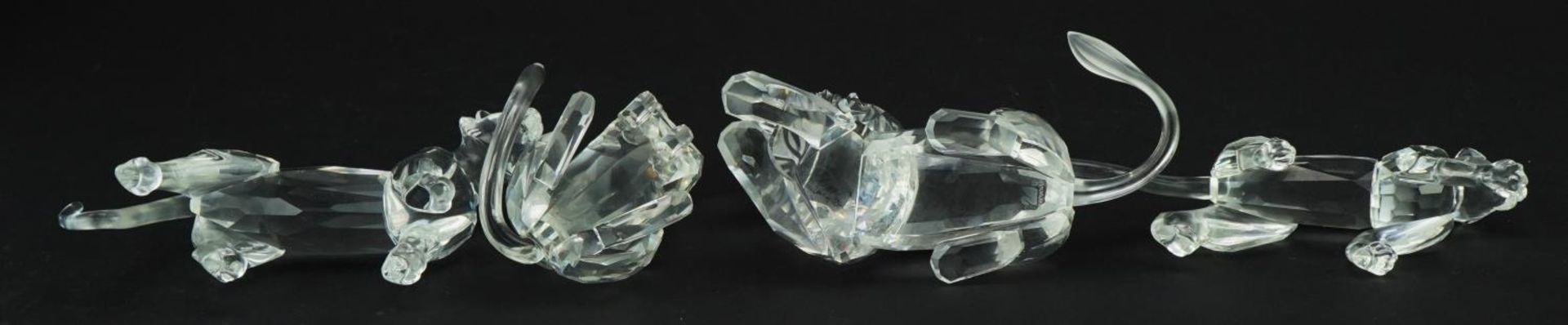 Four Swarovski Crystal big cats including lion and tiger, the largest 14cm in length For further - Image 3 of 4