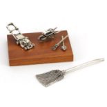 Miniature Italian silver diorama of a lawnmower, wheelbarrow, rake and spade and a silver model of a
