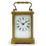 French brass cased carriage clock with enamelled dial having Roman numerals, 11cm high For further