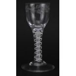 Eighteenth century wine glass with multiple opaque twist stem and etched bowl, 13cm high For further