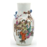 Chinese porcelain vase hand painted in the famille rose palette with two figures and decorated in