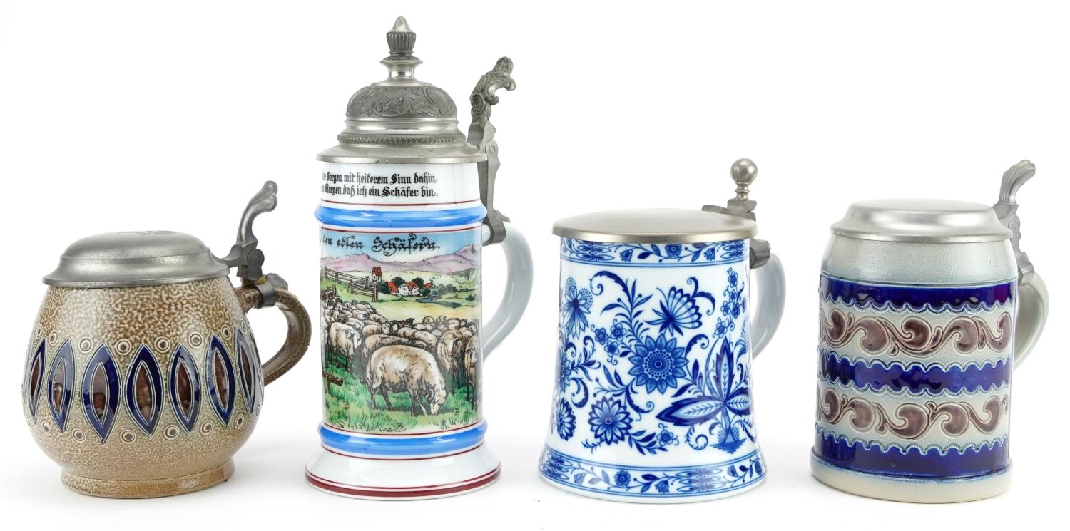 Four German beer steins including two Goebel and a blue and white KPM example, each with pewter