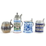Four German beer steins including two Goebel and a blue and white KPM example, each with pewter