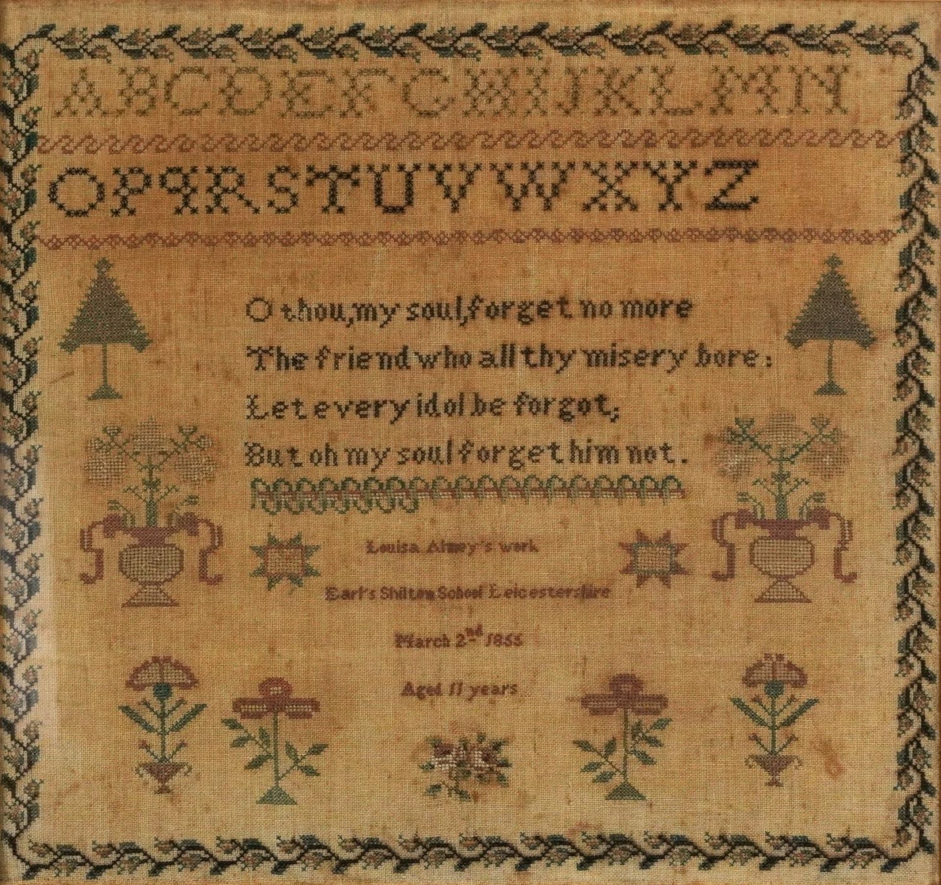 Mid 19th century needlework sampler with verse, alphabet and flowers by Louisa Almey aged 11,