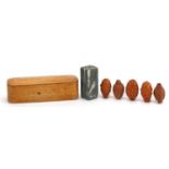 Five Chinese carved coquilla nuts and a hardstone desk seal with calligraphy, with hardwood case