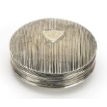 Circular Dutch silver pill box with engine turned decoration, impressed marks to the interior, 5cm