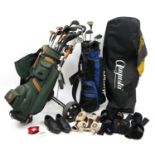 Collection of golf clubs in two caddies including Ping, Yonex, Tiger Shark and Powerbilt For further