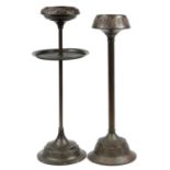 Two Dutch Art Nouveau copper floor standing smoker's stands, impressed marks to the bases, the