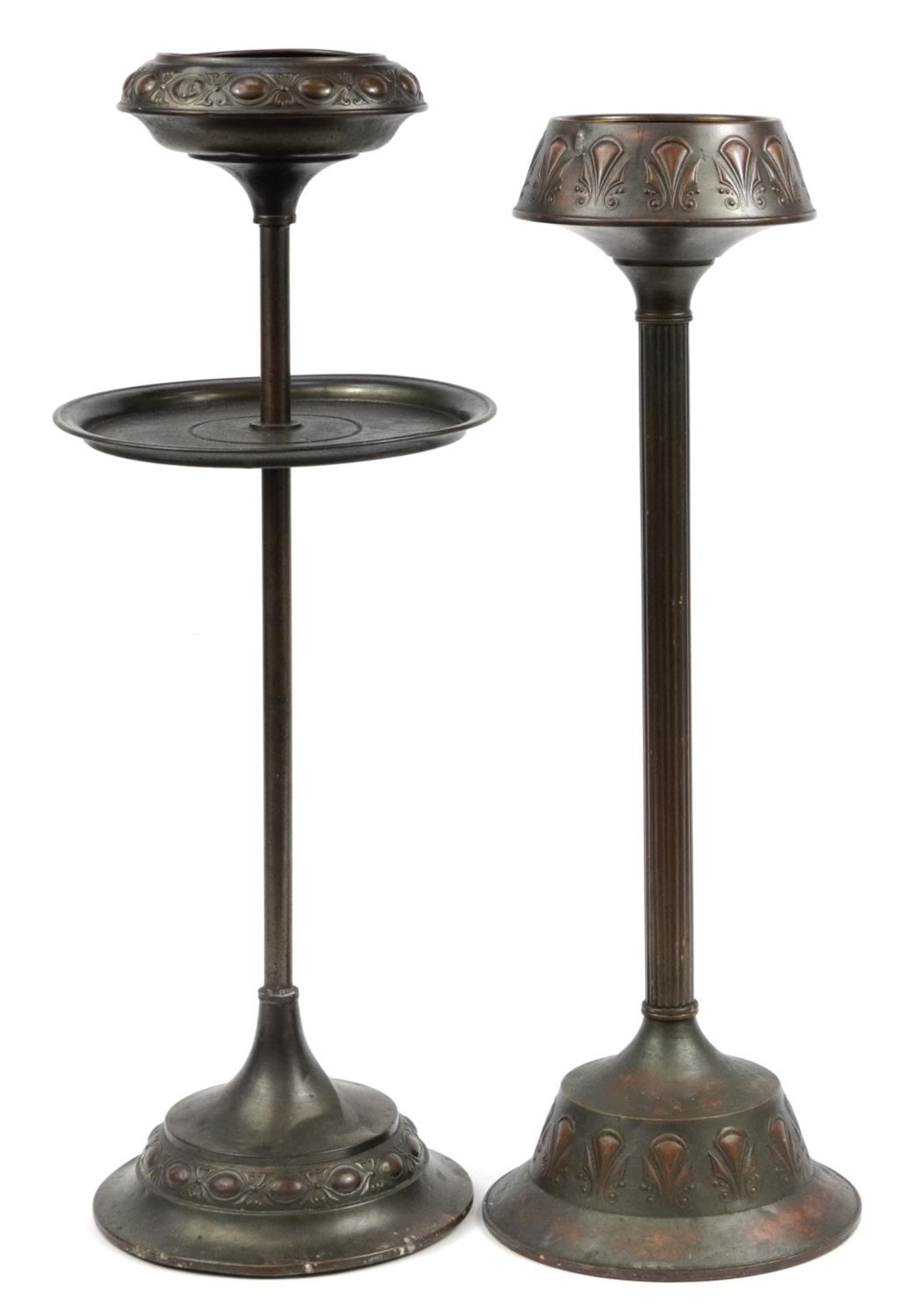 Two Dutch Art Nouveau copper floor standing smoker's stands, impressed marks to the bases, the