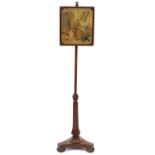 Regency mahogany pole screen with triangular base and tapestry screen embroidered with a seated