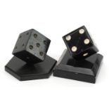 Manner of Edgar Brandt, Two Art Deco style painted cast metal dice design paperweights, the