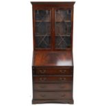 Mahogany bureau bookcase fitted with a pair of glazed door above a fall, with fitted interior and