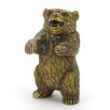 Novelty brass vesta case in the form of a bear with inset ruby eyes, impressed marks to the base,