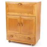 Ercol Windsor 469 light elm bureau/cocktail cabinet, 109.5cm H x 82.5cm W x 44cm D For further