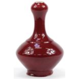 Chinese porcelain garlic head vase having a sang de boeuf glaze, 32.5cm high For further information