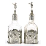Pair of Dutch silver mounted square glass bottles, pierced and embossed with courting couples and