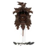 German Black Forest carved wood cuckoo clock with Cuendet paper label, 35.5cm high For further