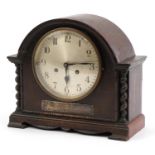 Oak cased mantle clock with silvered dial having Arabic numerals and silver presentation plaque