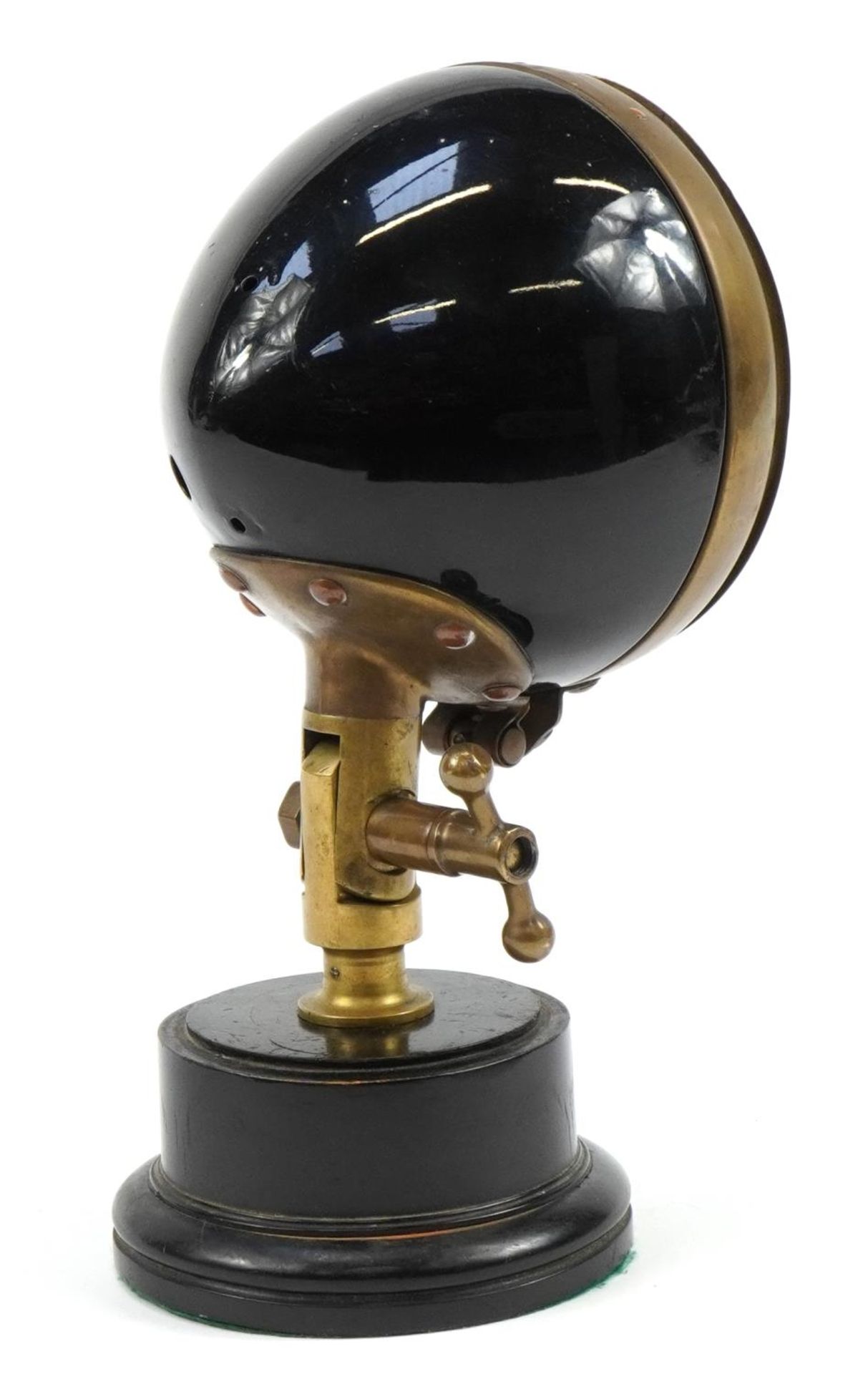 Vintage CAM brass and black enamel fire engine headlight mounted on a circular plinth base, 35cm - Image 2 of 3