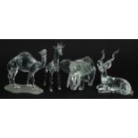 Four Swarovski Crystal animals comprising camel, giraffe, gazelle and elephant, the largest 13.5cm