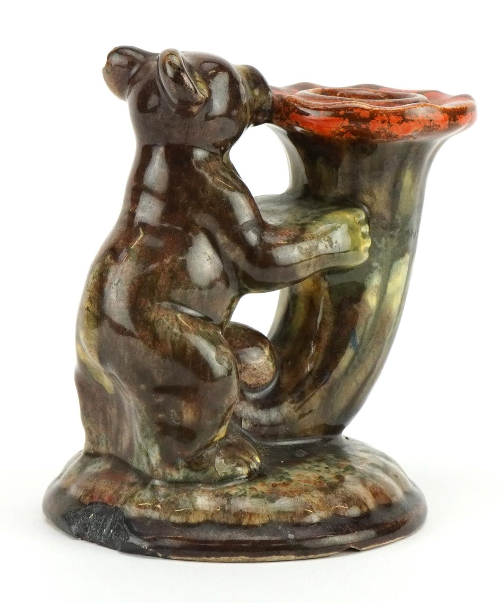 German Art Deco candlestick in the form of a bear holding a cornucopia having a mottled glaze, - Image 2 of 3