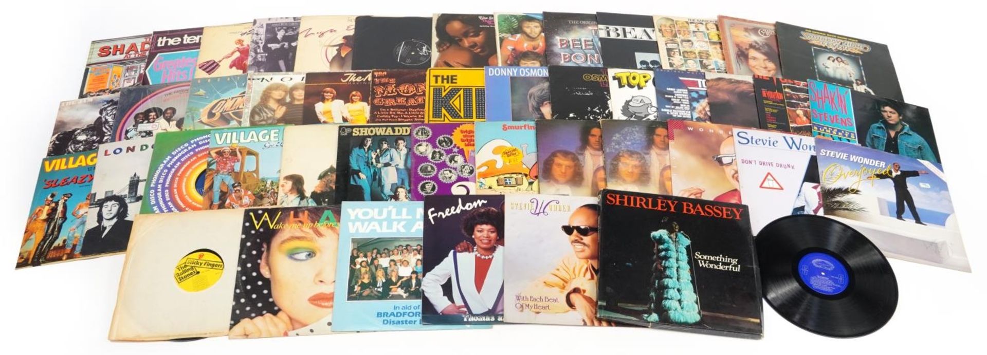 Vinyl LP records including Wings, Shakin' Stevens, Showaddywaddy, Stevie Wonder, The Jam and The