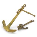 Two shipping interest brass anchors, the largest 24.5cm high For further information on this lot