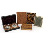 Victorian and later cases and a pressed photograph case housing two ornate gilt metal mounts,