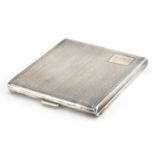 Art Deco rectangular silver cigarette case with engine turned decoration and gilt interior, J H W