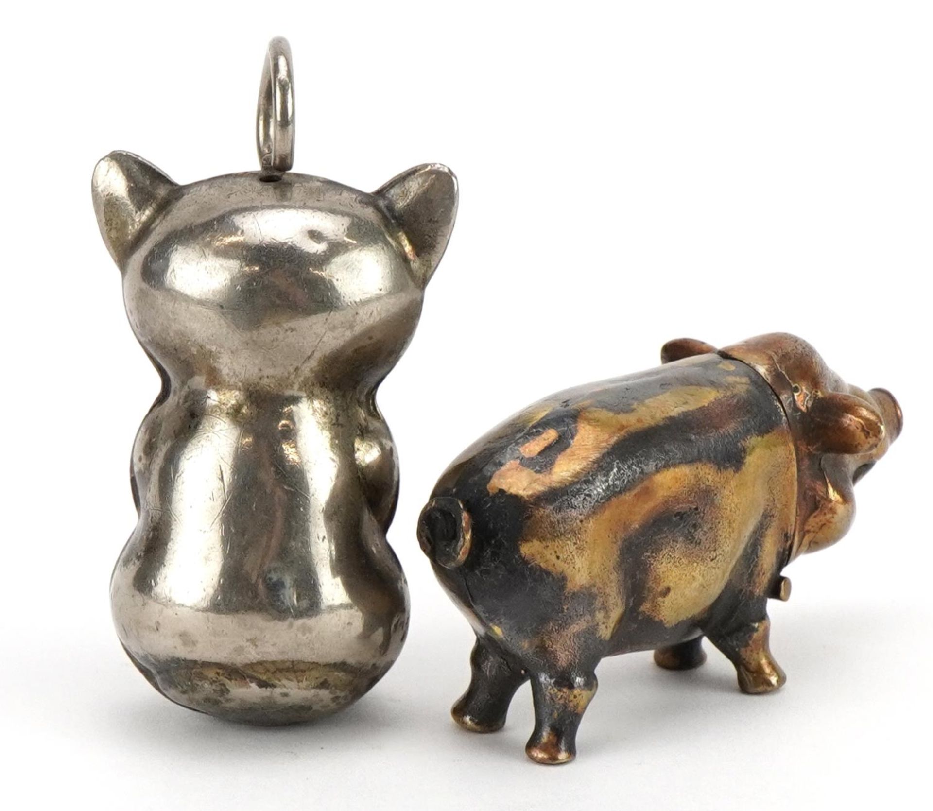 Novelty brass vesta case in the form of a pig and a silver plated baby's rattle in the form of a - Image 2 of 3