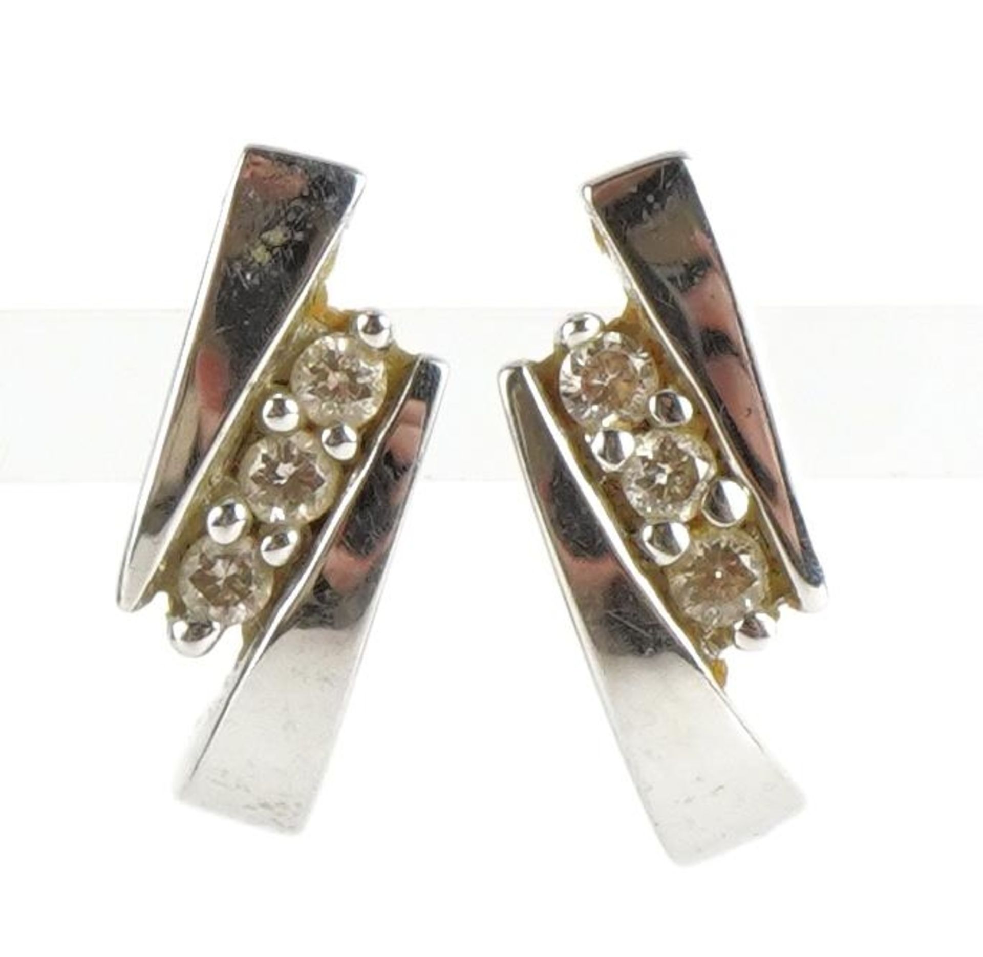 Pair of 9ct white gold diamond stud earrings, 1.1cm high, 1.2g : For further information on this lot