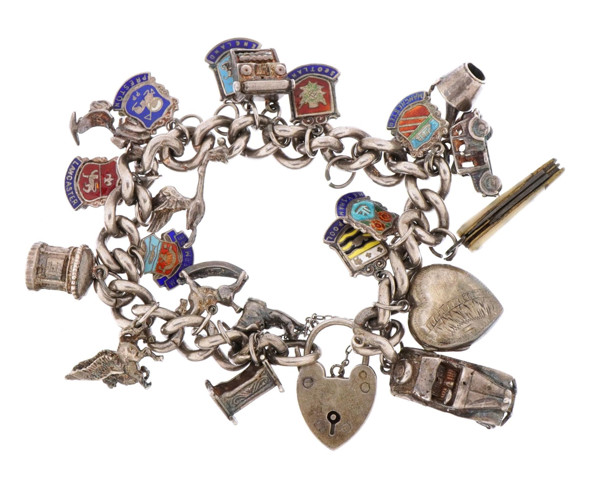 Silver charm bracelet with a selection of mostly silver and some enamel charms including opening