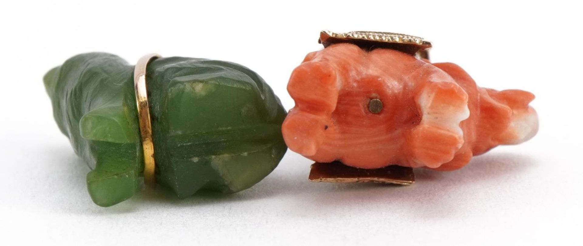 Two Chinese charms comprising carved coral elephant with 9ct gold mount and green stone cat, the - Image 3 of 4