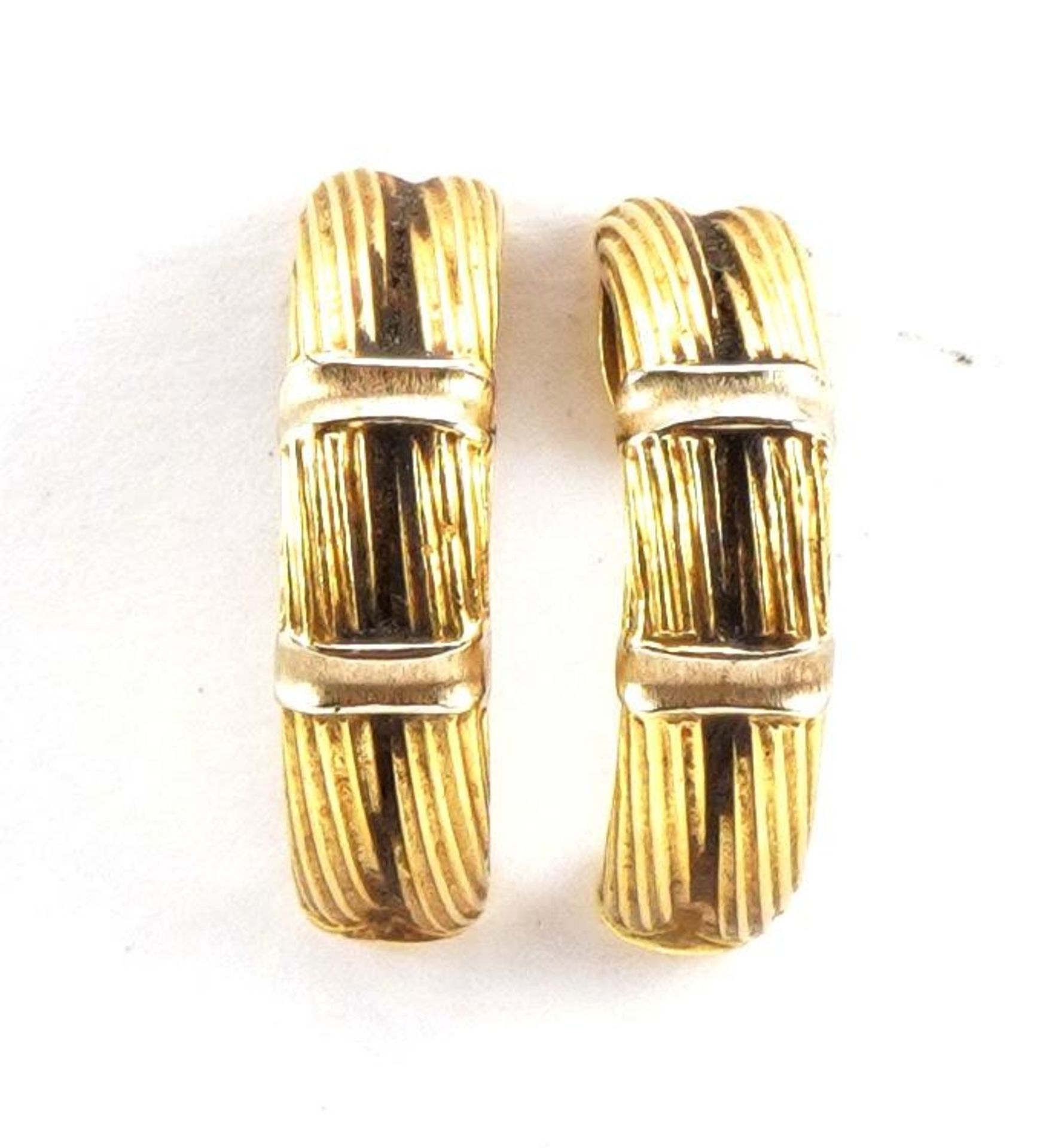 Pair of unmarked gold half hoop earrings, tests as 18ct gold, 2.1cm high, 7.4g : For further