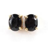 Pair of unmarked gold sapphire stud earrings, the backs marked 9ct, 6mm high, 1.4g : For further