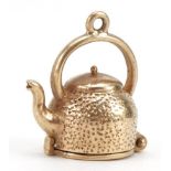 9ct gold kettle charm opening to reveal three fish, 1.8cm high, 3.8g : For further information on