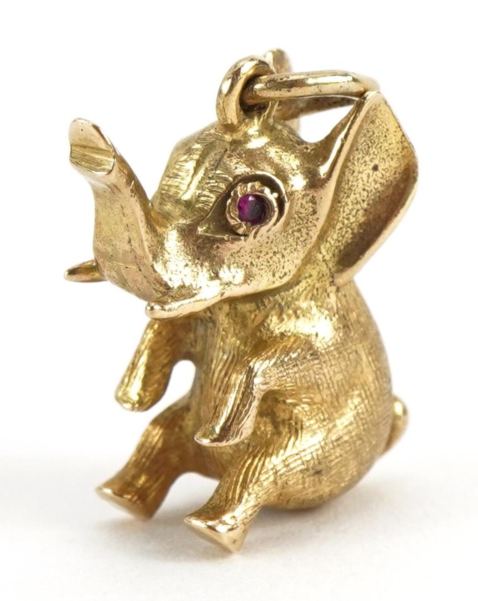 9ct gold elephant charm with ruby eyes, 2.0cm high, 4.5g : For further information on this lot