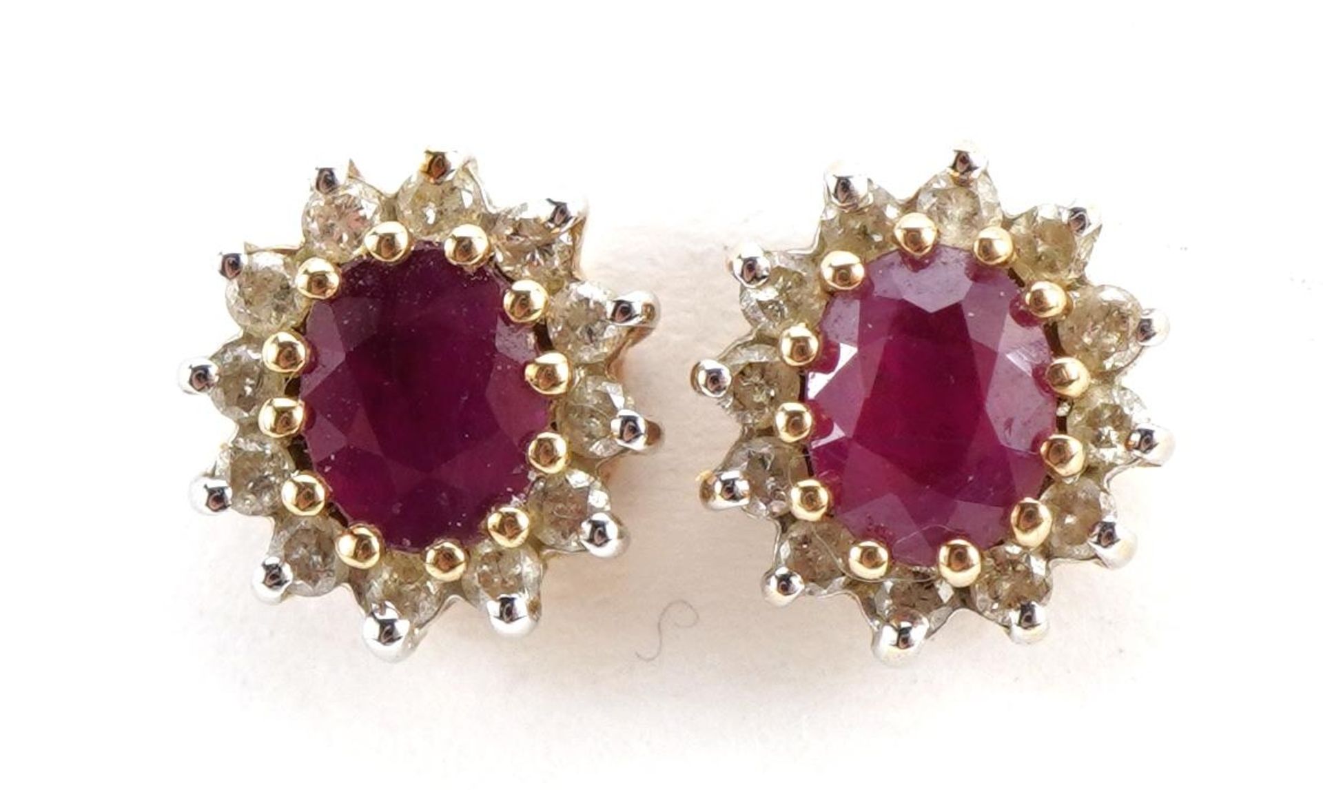 Pair of 9ct gold ruby and diamond two tier cluster stud earrings, 8mm high, 1.6g : For further