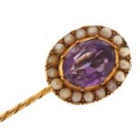 Unmarked gold amethyst and seed pearl cluster stickpin, the amethyst approximately 11.8mm x 9.4mm,